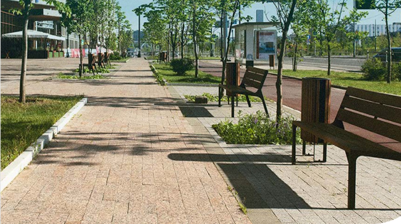 praça com bancos e árvores a luz do dia